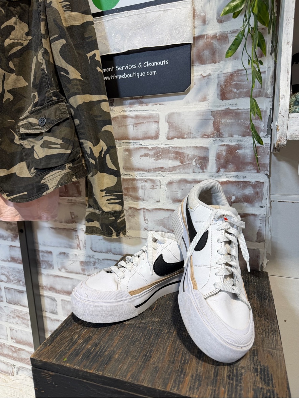 Nike White Sneakers with Black Swoosh and Gold Accent